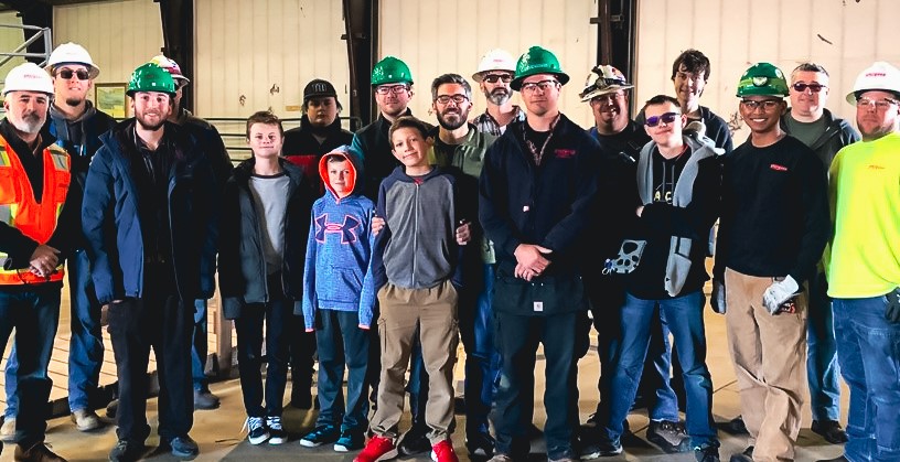 Sturgeon Electric team with a group of students