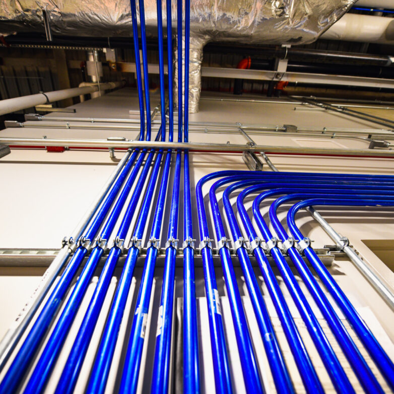 Blue power lines installed on a wall