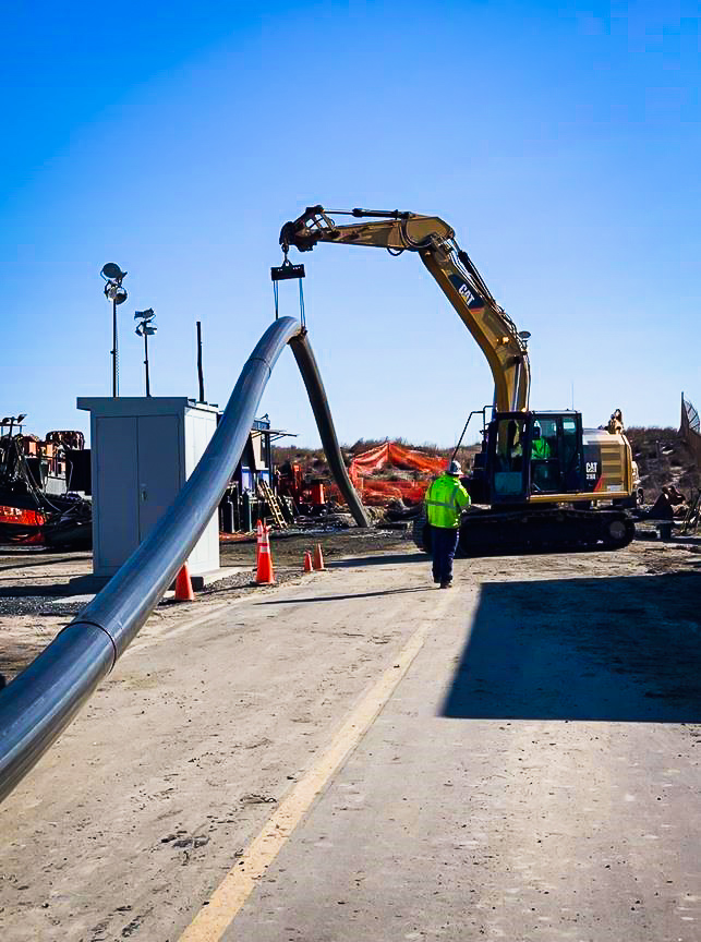 Caterpillar raises black pipe in construction zone