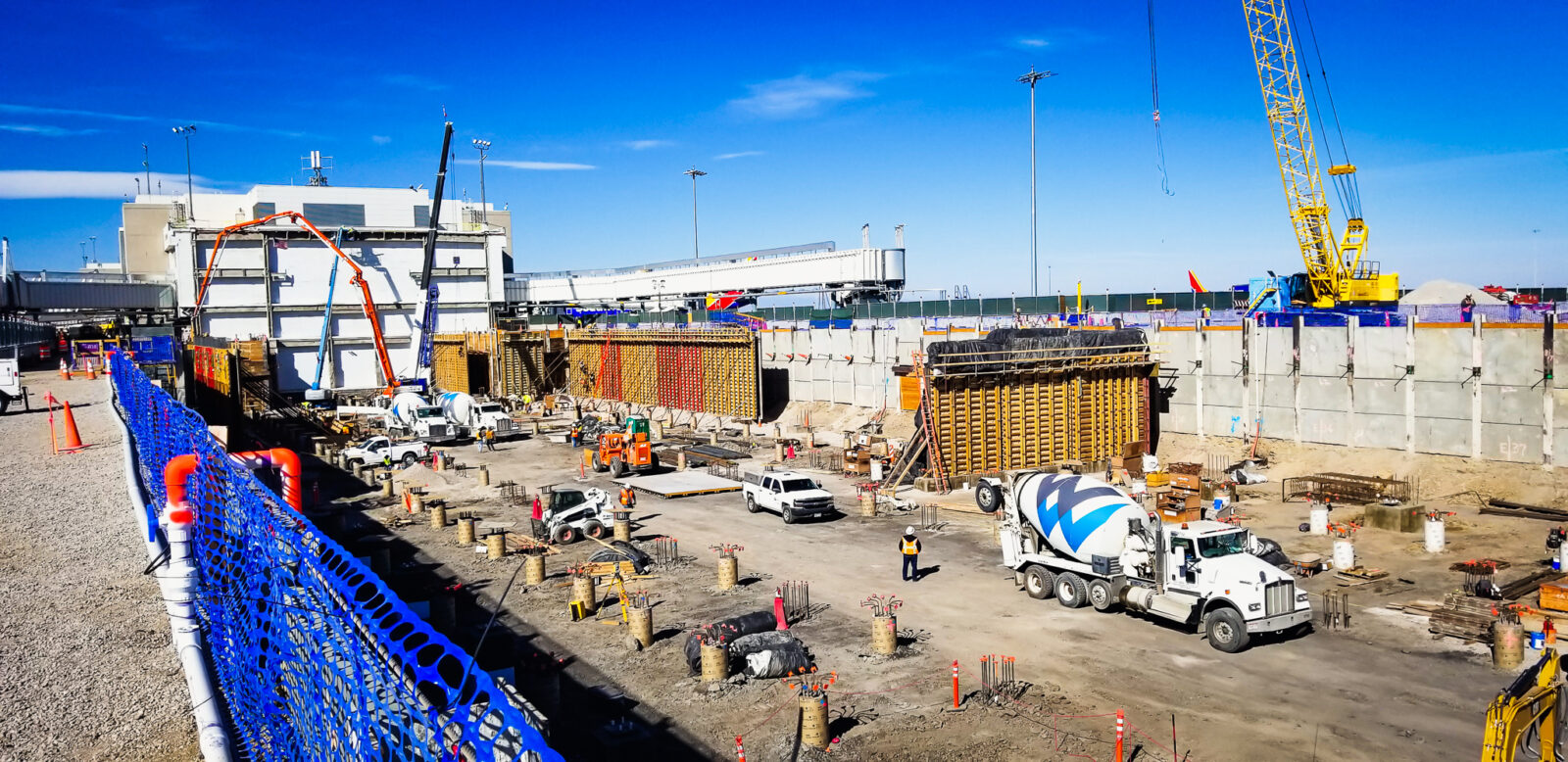 Construction crews working on the outside of Denver International airport during the day