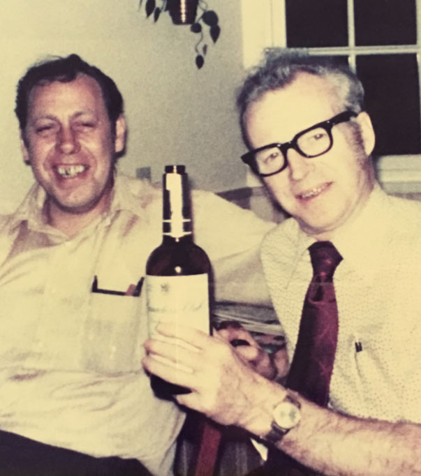 Dieter fettback and ernie moore enjoying a bottle of alcohol