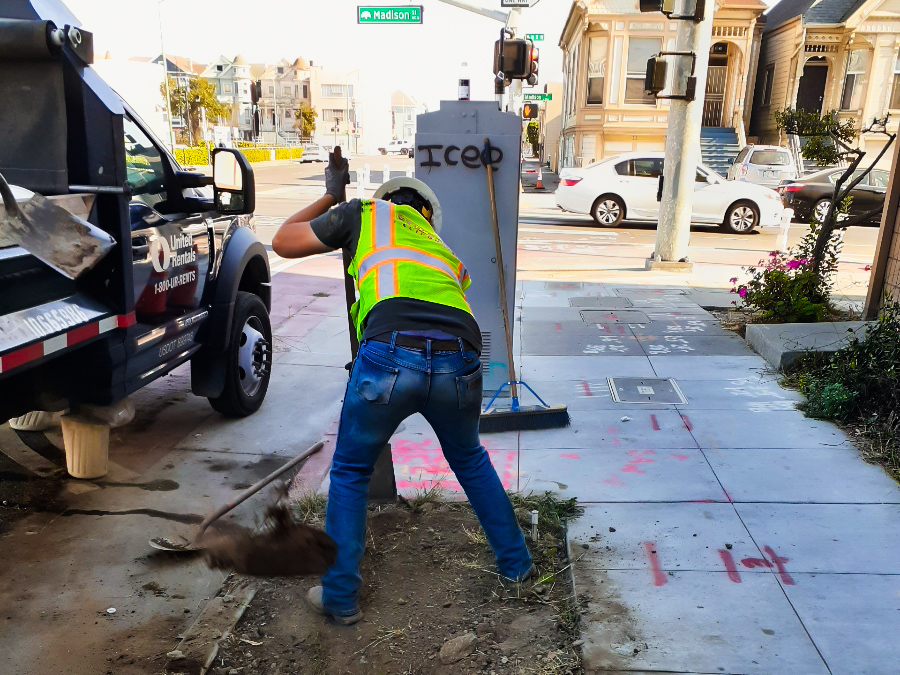 Worker digging up dirt using a shovel