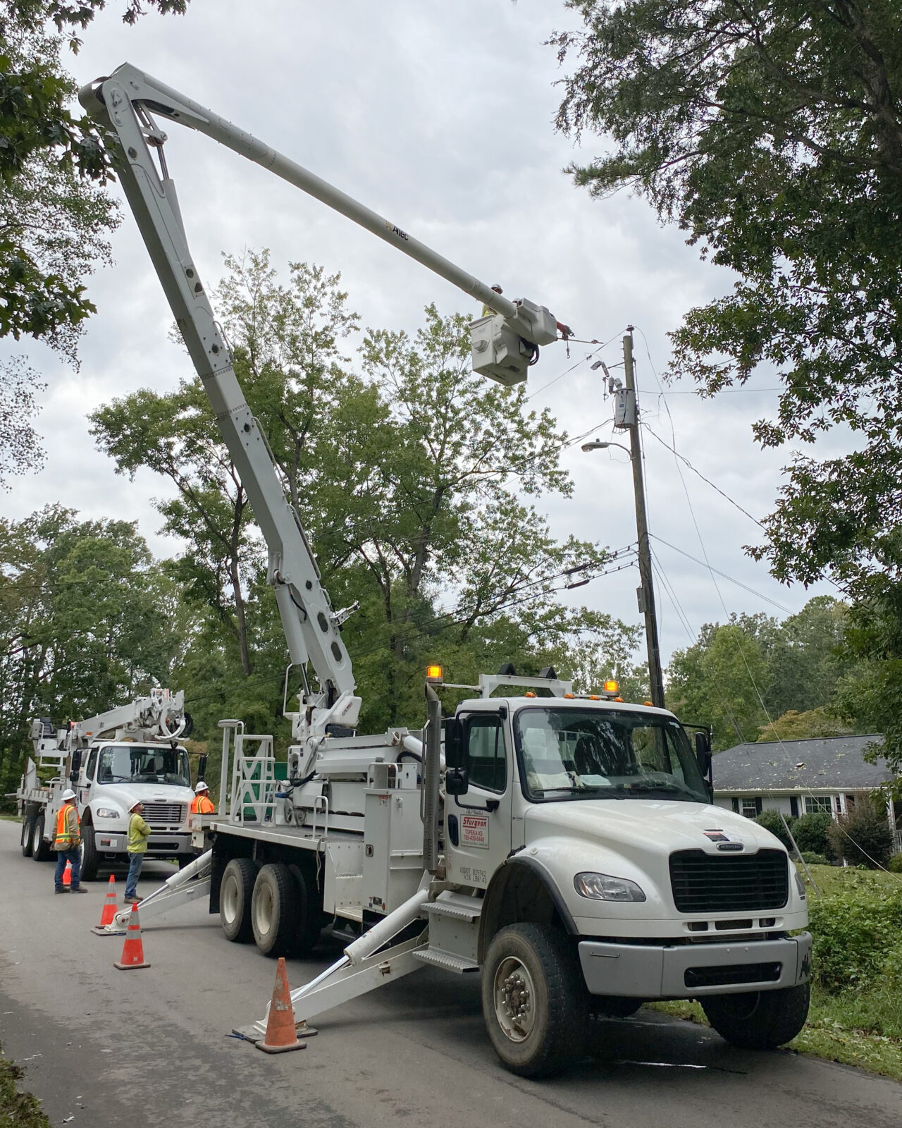 An electrical construction crew at work after a hurricane.