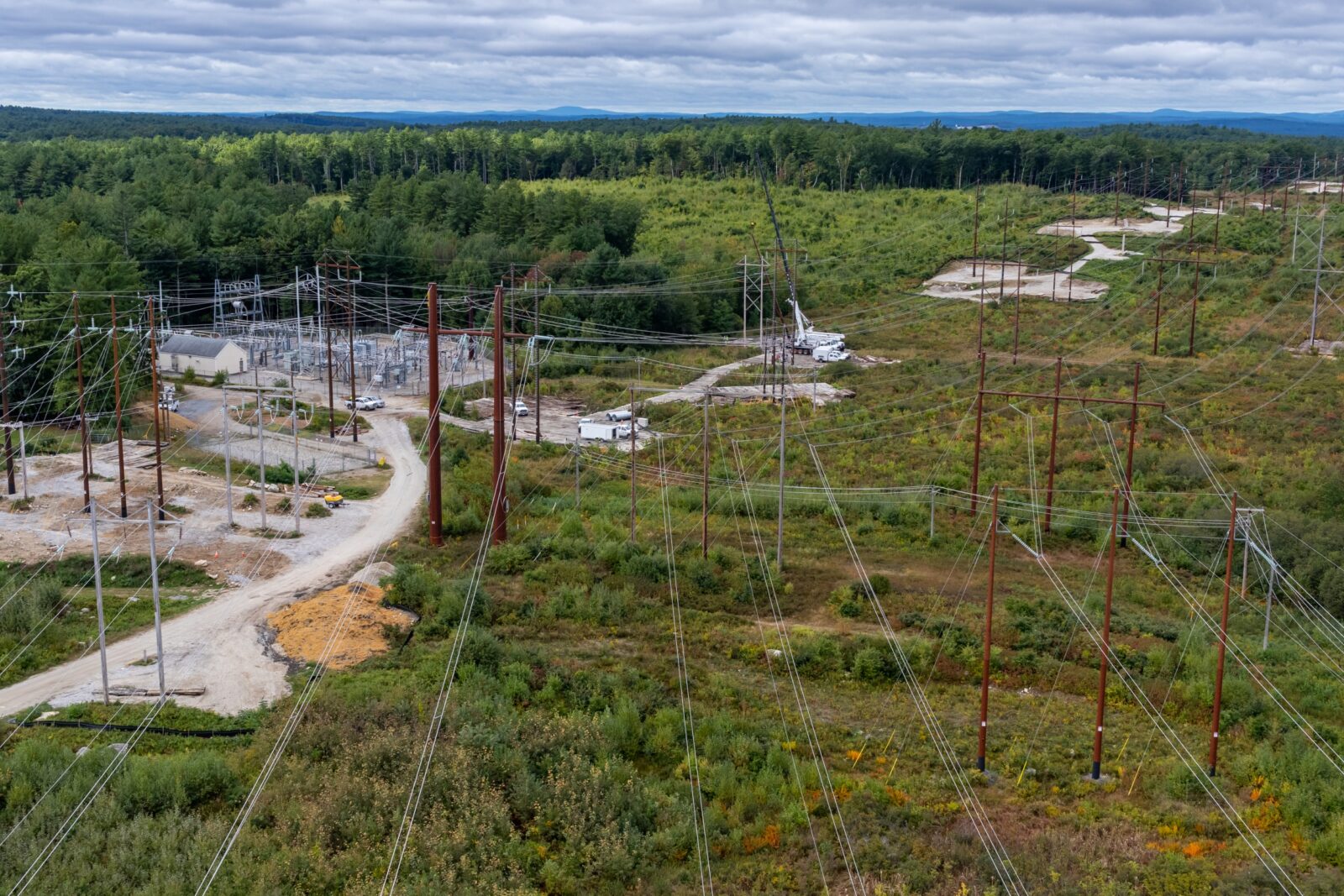 An aerial view of transmission lines being worked on