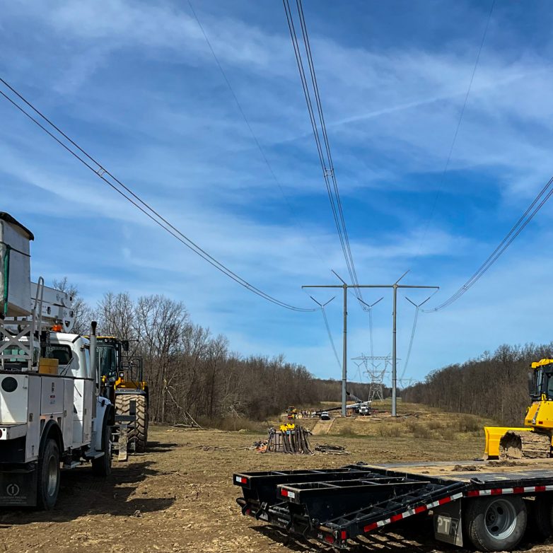 A 765kV transmission line and lattice after electrical construction storm restoration.