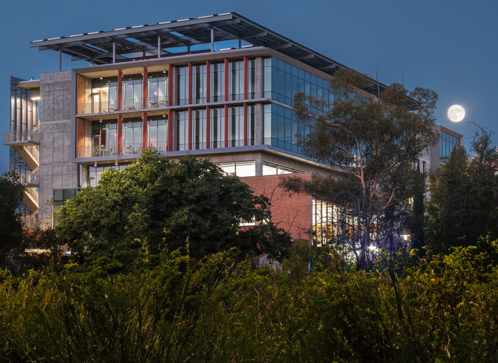 a large building with lots of windows at night