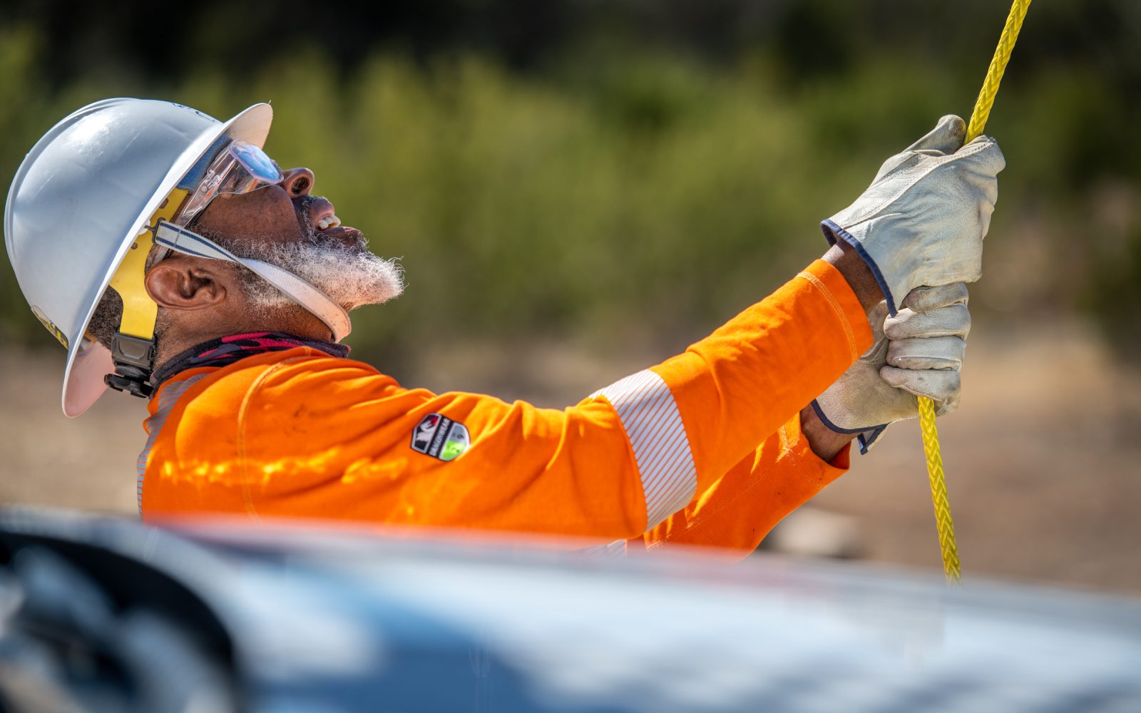 A lineworker holding a rope