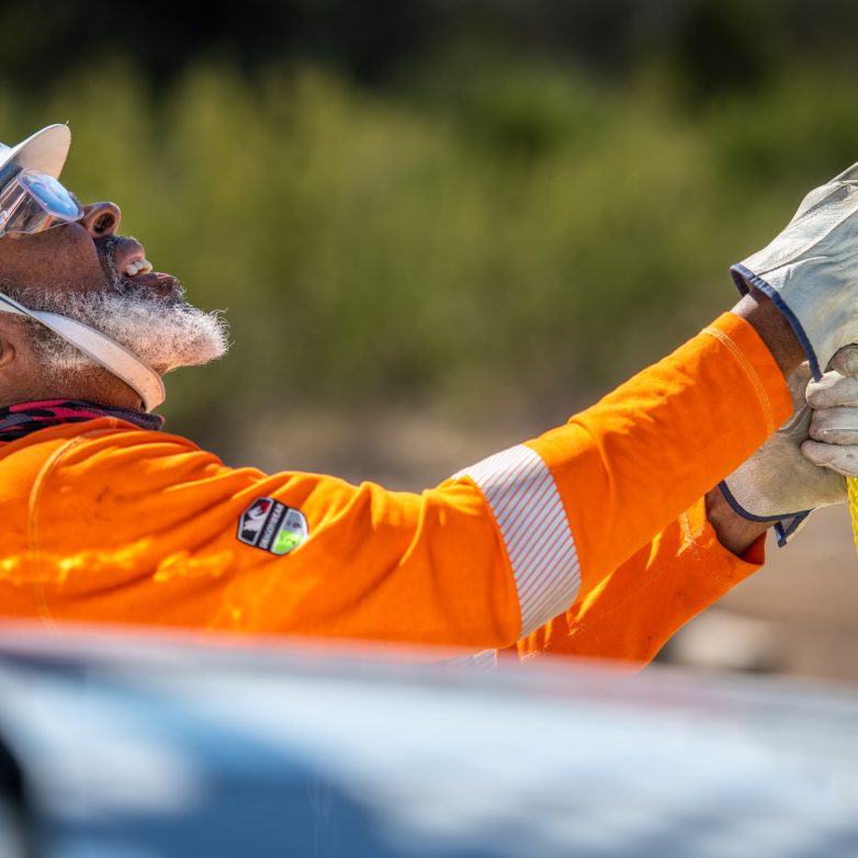 A lineworker holding a rope